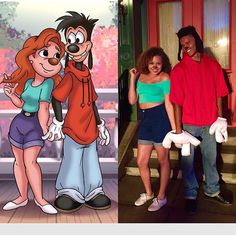 two people standing next to each other in front of cartoon characters