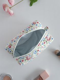 "This cute and floral makeup bag will help you in many ways. You can put your makeup in this toiletry bag when you are at a party or out. You can make a loved one happy by gifting it to a friend. If you are going to travel, you can put your cosmetic bag in your suitcase and prevent your make-up materials from being messy.You can use it as a pencil case when going to school.🌸 🧺Materials: Cotton fabric is used in the outer and inner fabric. There is a fiber fabric between the two, so we have a f Cute Rectangular Zipper Pouch For Cosmetics And Toiletries, Cute Rectangular Cosmetic And Toiletry Zipper Pouch, Floral Makeup Bag, Toiletry Bag Women, Floral Makeup, School Materials, Going To School, Cute School Supplies, Soft Makeup