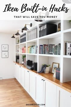 a bookshelf filled with lots of books on top of a wooden floor next to white cabinets