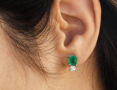 Elegance defined! The perfect gift for someone celebrating a birthday or anniversary, these emerald cut earrings are fashioned in solid 18k yellow and white gold. They feature genuine rare emeralds accented with natural white diamonds. The emeralds have a combined 2.60 total carat weight and a rich green hue that contrasts with the flashing fire of the diamonds. Portrayed from the underside for enhanced brilliance and sparkle, the princess cut diamonds have a combined 0.40 total carat weight. Se Stud Designs Gold, Diamond Emerald Earrings, Beautiful Diamond Earrings, Emerald Diamond Earrings, Earrings Emerald, Emerald Earrings Studs, Cut Earrings, Stud Earrings Gold, Fancy Earrings