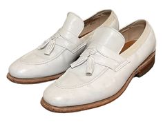 "Vintage 2000s Snow White Genuine Leather Men Slip On Loafers-US Men Size 6. A great pair of stylish white loafers that can be dressed up or slipped on with an old pair of jeans. These were made in the 2000s in the USA. The Brand is Allen Edmunds. They are 100% leather, upper, soles and lining.  height: 3.25\" length: 11\" insole: 9.5\" width: 3.75\" heel: 1\" Material: leather  Color: white Condition: GOOD VINTAGE" White Slip-on Tassel Loafers For Formal Occasions, White Slip-on Tassel Loafers For Business, White Tassel Loafers For Business, White Classic Tassel Loafers For Galas, Classic White Wingtip Tassel Loafers, White Loafers For Spring Galas, White Round Toe Casual Tassel Loafers, White Casual Tassel Loafers With Round Toe, White Dress Shoes Men