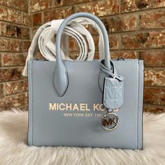 New With Tag 100% Authentic Modern Blue Satchel With Branded Hardware, Modern Blue Michael Kors Bags, Light Blue Leather Bag With Branded Hardware, Michael Kors Blue Bag For Shopping, Blue Michael Kors Shopping Bag, Blue Michael Kors Tote Shoulder Bag, Blue Michael Kors Bag For Shopping, Medium Blue Bag, Michael Kors Blue Bag With Branded Hardware