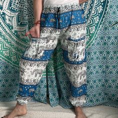 Thai Drawstring two pocket Harem Pants Waist: 23" - 46Hip: 50"Lenght: 43"Inseam: 28"Pockets: twoWeight: 170g Blue Relaxed Fit Harem Pants With Pockets, Beach Harem Bottoms With Pockets, Bohemian White Pants With Pockets, White Bohemian Pants With Pockets, Bohemian Summer Cargo Pants With Pockets, Bohemian Long Pants With Side Pockets, Loosely Fitted Blue Bottoms With Side Pockets, Cotton Beach Pants With Cargo Pockets, Cotton Cargo Pants For Beach