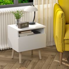 a white table with a plant on it next to a yellow chair