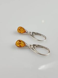 Little teardrop shape Amber earrings. Total length 3 cm drop size 1.2 cm. Sterling silver 925. With hallmarks. Leaverback. Colour might be sightly darker than in a photo. This item was made of natural Baltic Amber. All the amber used in my jewelry is collected in my home country Lithuania. I sell only genuine, real, not pressed, authentic, natural Baltic Amber. Item may have natural imperfections. Due to amber being natural, each of my jewelry is unique and even the same models can be slightly d