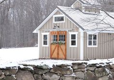 a small house with snow on the ground