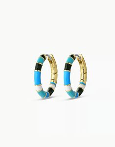 The Gigi Enamel Stripe Hoop earrings instantly elevate an outfit. Their lightweight, statement-making style features an enamel design accented by a stunning gold-plated finish. Easily style them with other gold or diamond studs and huggies to complete your look! Profile diameter measures 3/4" Hand painted enamel Surgical steel post with hinge closure Available in 18k gold plated brass Avoid contact with anything containing derivatives of alcohol Gold Enamel Huggie Earrings, Trendy Enamel Hoop Jewelry, Trendy Yellow Gold Enamel Jewelry, Trendy Enamel Earrings For Everyday, Trendy Round Enamel Hoop Earrings, Trendy Enamel Huggie Earrings, Modern Enamel Hoop Earrings, Gold Enamel Hoop Huggie Earrings, Trendy Gold Enamel Hoop Earrings