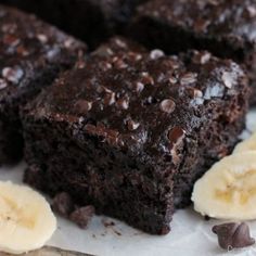 some brownies and bananas on a white plate