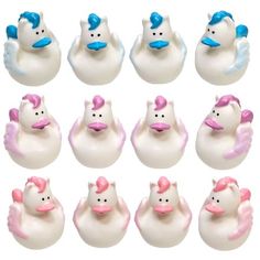 twelve white rubber ducks with pink bows and blue tails, all facing different directions on a white background