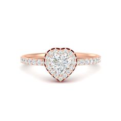 a heart shaped diamond engagement ring with diamonds on the band and side stones in rose gold