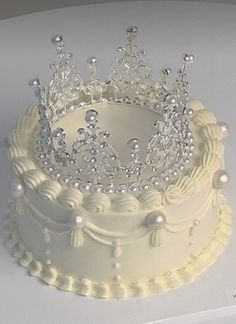 a white cake with a tiara on top