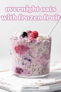 overnight oatmeal with frozen fruit in a glass bowl on top of a book