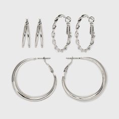 Add a variety of designs and sleek style to your accessories collection with this 3-Pair Twisted and Duo Hoop Earring Set from Universal Thread™. This set of earrings includes three pairs — one pair of twisted hoops, one pair of large hoops and one pair of duo hoops — to add variety to your everyday looks. Each pair boasts a nickel-free construction to suit all types of skin, and their clip-in clasp closures help keep the earrings securely in place as you go about your day. Universal Thread™: Th Jewelry Closet, Target Finds, Universal Thread, Hoop Earring Sets, Sleek Fashion, Clip Ins, Silver Hoops, Silver Hoop Earrings, Everyday Look