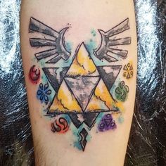 a watercolor tattoo on the leg of a man with an image of a bird and triangle