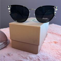 Sunglasses Made By Miu Miu Are Women's Sunglasses. They Have A Cat Eye Shape With Pearls. Color- Black & Gold New! Comes With Case And Box. Authentic! Size 55mm Shape Cat Eye Gender Female Material Metal Stainless Steel Bridge Type Single Bridge Rim Type Full Rim Trendy Miu Miu Sunglasses For Formal Occasions, Chic Miu Miu Sunglasses For Party, Modern Miu Miu Sunglasses For Party, Miu Miu Sunglasses With Uv Protection For Party, Miu Miu Party Sunglasses With Uv Protection, Miu Miu Luxury Party Sunglasses, Luxury Miu Miu Party Sunglasses, Chic Miu Miu Sunglasses For Evening, Chic Miu Miu Evening Sunglasses