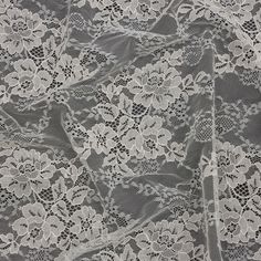 white lace fabric with flowers on it