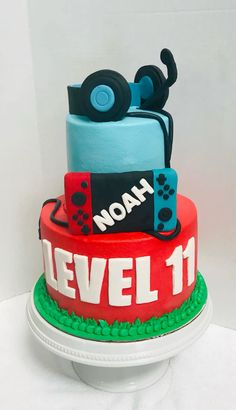 there is a cake that says level 11 on the top and has video game controllers on it