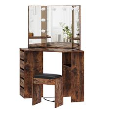 a wooden vanity table with a mirror and stool