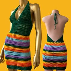 a crocheted dress is displayed on a mannequin's head and torso