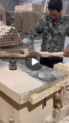 a man is making something out of wood