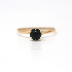 Beautiful antique Edwardian era 10k yellow gold solitaire ring, circa 1910s! This dainty ring features a genuine bloodstone gem center weighing approximately .56 cts, which is secured by 6 prongs. The setting is slender and lightweight by design, with a high polished finish. Classic piece of fine vintage gemstone jewelry, circa 1910s!  ERA - Circa 1910s - Edwardian METAL / MATERIAL - 10k yellow gold, genuine bloodstone gem (.56 cts) MARKINGS / HISTORY - Inside of band is stamped "LK" CONDITION - Good antique condition. Piece has been professionally cleaned and lightly polished. Ring is very dainty & lightweight by design. Lovely antique gem ring! SIZE / MEASUREMENTS - Size: 6 1/4, Bloodstone: 5.23 x 5.23 x [D] 2.77 mm, Rise of ring off of finger: 6.91 mm, Weight: .80 grams, Back of shank: Bloodstone Ring, Yellow Gold Solitaire Ring, Yellow Gold Solitaire, Zierlicher Ring, Gold Solitaire Ring, Logo Gifts, Gem Ring, Edwardian Era, Dainty Ring