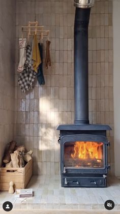 a wood burning stove in a tiled room