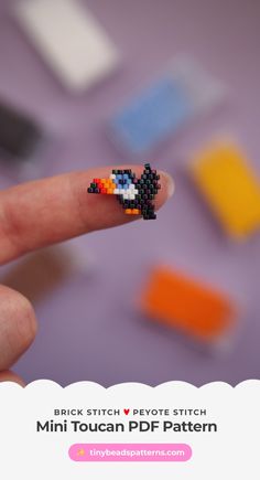 a hand holding a tiny beaded bird on it's thumb with the text brick stitch peyo stitch mini toucan pdf pattern