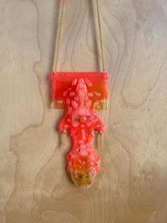 One of a kind hot pink pendant sculpted from recycled plastic, acrylic, resin and glue on a gold-plated chain.  All necklaces come in pre-made lengths designed to fit most people, but if you have a specific length in mind, please message me and I'm happy to accommodate! Pink Plastic Necklaces As Gifts, Pink Plastic Necklace For Gift, Pink Plastic Necklace Gift, Handmade Pink Plastic Necklace, Pink Plastic Party Necklace, Pink Resin Party Necklaces, Pink Necklace With Large Pendant, Pink Resin Pendant Necklace, Unique Pink Necklace With Large Pendant