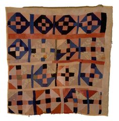 an old piece of cloth with geometric designs on it