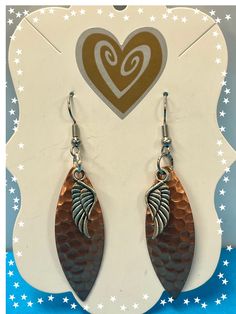 These unique handmade earrings have silver angel wings set on real fishing lures!  They come with a clear jewelry bag and silicone earring backs.  Enjoy! Handmade Silver Wing-shaped Earrings, Teardrop Fish Hook Earrings Gift, Pierced Winged Earrings As Gift, Silver Hypoallergenic Copper Earrings, Winged Jewelry With Ear Wire For Gifts, Handmade Winged Earrings For Gifts, Clear Jewelry, Unique Handmade Earrings, Silver Angel Wings