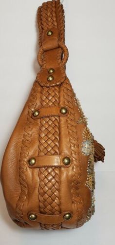 Designer Brown Hobo Bag For Evening, Brown Embellished Luxury Bag, Designer Handmade Brown Shoulder Bag, Luxury Brown Embellished Bags, Luxury Embellished Brown Bag, Designer Embellished Leather Shoulder Bag, Luxury Leather Embellished Shoulder Bag, Luxury Embellished Leather Shoulder Bag, Elegant Embellished Brown Shoulder Bag