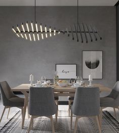 a dining room table with chairs and a chandelier hanging from the ceiling