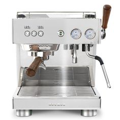 an espresso machine is shown with the controls on it's front and side