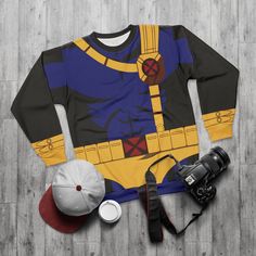 Cyclops Long Sleeve Shirt, Mutant Human Costume, Scott Summers Cosplay, Comic-Con Outfit, Halloween Event Apparel, Fashion for runDisney  This matching item click link below  Unisex Shirt  https://dreamwardrobeshop.etsy.com/listing/1734293161/cyclops-unisex-shirt-mutants-human Leggings  https://dreamwardrobeshop.etsy.com/listing/1726380362/cyclops-leggings-mutant-human Item Details Unisex, is the perfect match for both men and women. A pullover has a crew neck, long sleeves, and a classic fit style. With quality all-over printing capabilities, you won't be worried about white lines in the seams. This fleece is custom cut & sewn and features a crew neck and a set-in sleeve to keep you warm. .: Classic fit .: Polyester, extremely strong and durable synthetic fabric .: Retains its shape and d Fandom Tops With Character Print For Cosplay, Fandom Character Print Tops For Cosplay, Fandom Cartoon Print Tops For Cosplay, Fandom Cartoon Print Cosplay Tops, Cosplay Pop Culture Top With Cartoon Print, Cosplay Pop Culture Tops With Cartoon Print, Pop Culture Tops With Cartoon Print For Cosplay, Superhero Cosplay Costume With Long Sleeves, Halloween Cosplay Top With Character Print