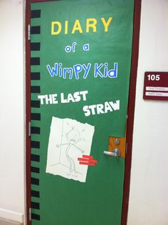 a green door with the words diary of a wimpy kid written on it