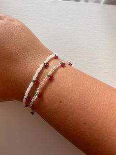 handmade cherry seed bead bracelet Trendy Bangle With Tiny Beads Jewelry, Trendy Bangle With Tiny Beads, Gift Bracelets With Beaded Chain And Round Beads, Handmade Dainty Pearl Bracelet With Round Beads, Friendship Bracelets With Beaded Chain As Gift, Trendy Beaded Bracelets With Round Beads, Red Beaded Dainty Jewelry, Trendy Adjustable Cherry Jewelry, Trendy Cherry Adjustable Jewelry