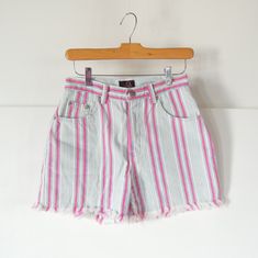 "Brand: Sasson Size: 3/4 (vintage sizes run small so these are more like a modern size 2-please read measurements) cotton Very nice condition Vertical stripes Hot pink light blue and white Sasson Paris New York 80's or 90's era High waist/rise Fray hem edges Cut offs 26 1/2\" waist 36\" hips 11\" front rise 15\" back rise 22\" around thigh at opening 3 1/2 ' inseam" Vintage White Bottoms For Summer, Relaxed Fit 90s Bottoms For Spring, 90s Style High Rise Summer Bottoms, High-rise 90s Style Summer Bottoms, Retro Bottoms With Frayed Hem For Spring, Retro Short Bottoms With Frayed Hem, Retro Cutoff Bottoms For Summer, 90s High Waist Summer Bottoms, 90s Style High Waist Summer Bottoms