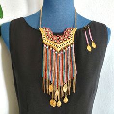 Unique Boho Necklace And Earrings Set Gold Tone Bib With Crystals And Multi Color Chain Tassels With Gold Leaves Necklace Measures 20" In Length Metal Bib And Tassels Hang 10" Matching Chain Tassel Hook Earrings Hang 3.5" Beautiful Set #14 Bohemian Bollywood Hip Hippie Gypsy Festival Fun Trendy On Trend Trending Boho Dangle Tassel Jewelry For Festival, Bohemian Jewelry With Latkans For Party, Multicolor Fringe Jewelry As A Gift, Bohemian Dangle Chain Jewelry, Bohemian Gold Jewelry Sets, Multicolor Jewelry With Dangle Adjustable Chain, Bohemian Dangle Jewelry Sets For Party, Bohemian Gold Jewelry Sets For Party, Bohemian Adjustable Jewelry Sets For Party