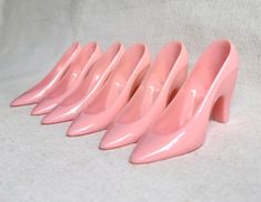 6 vintage plastic pink heels.  Cinderella style.  The plastic is strong.  Party favors or room decoration.  Each one has a little platform by the pointy toe approx 3/4 x 1 in to display something.  3 1/2 in long 1 1/8 in wide 2 1/8 in tall Check out my handmade clothing at kissmyattitude.etsy.com Vintage Pink Party Heels, Pink Vintage Party Heels, Vintage Pink Heels For Party, Vintage Pink Heels For Formal Occasions, Pink Retro Heels With Pointed Toe, Heels Cinderella, Shoes Party, Plastic Heels, Pink Slippers