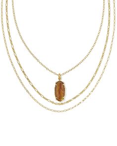 Charmingly eclectic and totally fierce, wearing the Ellie Vintage Gold Bamboo Frame Triple Strand Necklace in Marbled Amber Illusion is always a good idea. Combining textured strands with our signature stone shape, this three-in-one style lets you get in on the layered necklace trend effortlessly. From its bamboo-inspired frame to the perfectly layered strands, this one’s undeniably unique—and totally chic. Metal Vintage 23k Yellow Gold Over Brass Material Marbled Amber Illusion Closure Toggle S Short Pendant Necklace, Sold Out Sign, Trending Necklaces, Bamboo Frame, Kendra Scott, Brass Material, Strand Necklace, Shop Earrings, Layered Necklaces