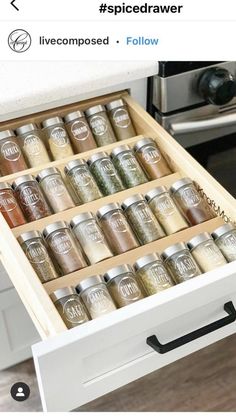 an open drawer with spices in it and the words spice drawer written on top of it