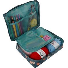 an open suitcase filled with knitting supplies