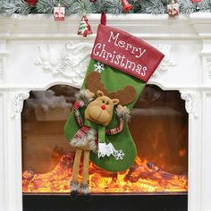 a christmas stocking hanging from the fireplace with a reindeer on it's head