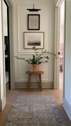 Neutral hallway runners | picture frame molding | hallway decor Bedroom Landing Ideas, Entryway With No Wall Space, Entryway Opposite Wall, Simple Modern Entryway, White Narrow Hallway, Wall Near Stairs Decor, Kitchen Hallway Decor, Slanted Entryway Wall, Entrance Way Gallery Wall