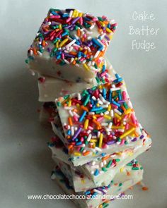 three pieces of cake batter with sprinkles stacked on top of each other