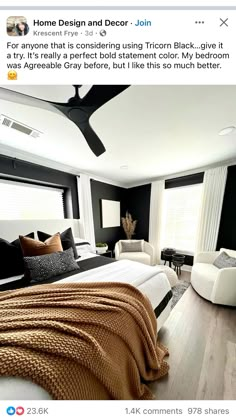 a bedroom with black walls and white furniture