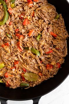 a close up of food in a pan with the words cuban ropa veja on it