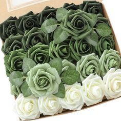 a box filled with green and white roses