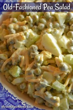 a blue and white plate topped with salad