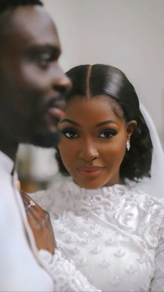 a bride and groom pose for a photo